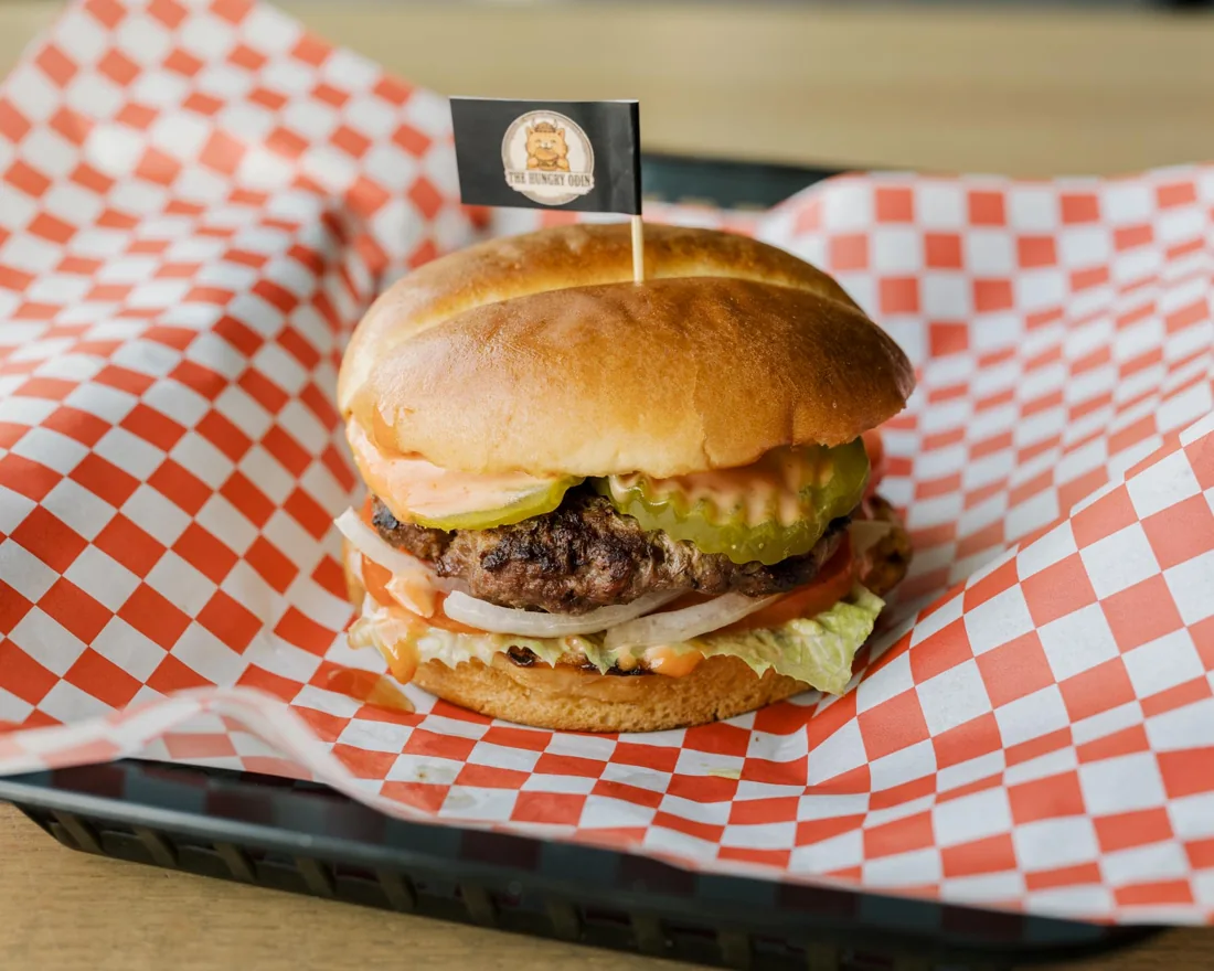 Real The Hungry Odin cheeseburger on a checkered tray
