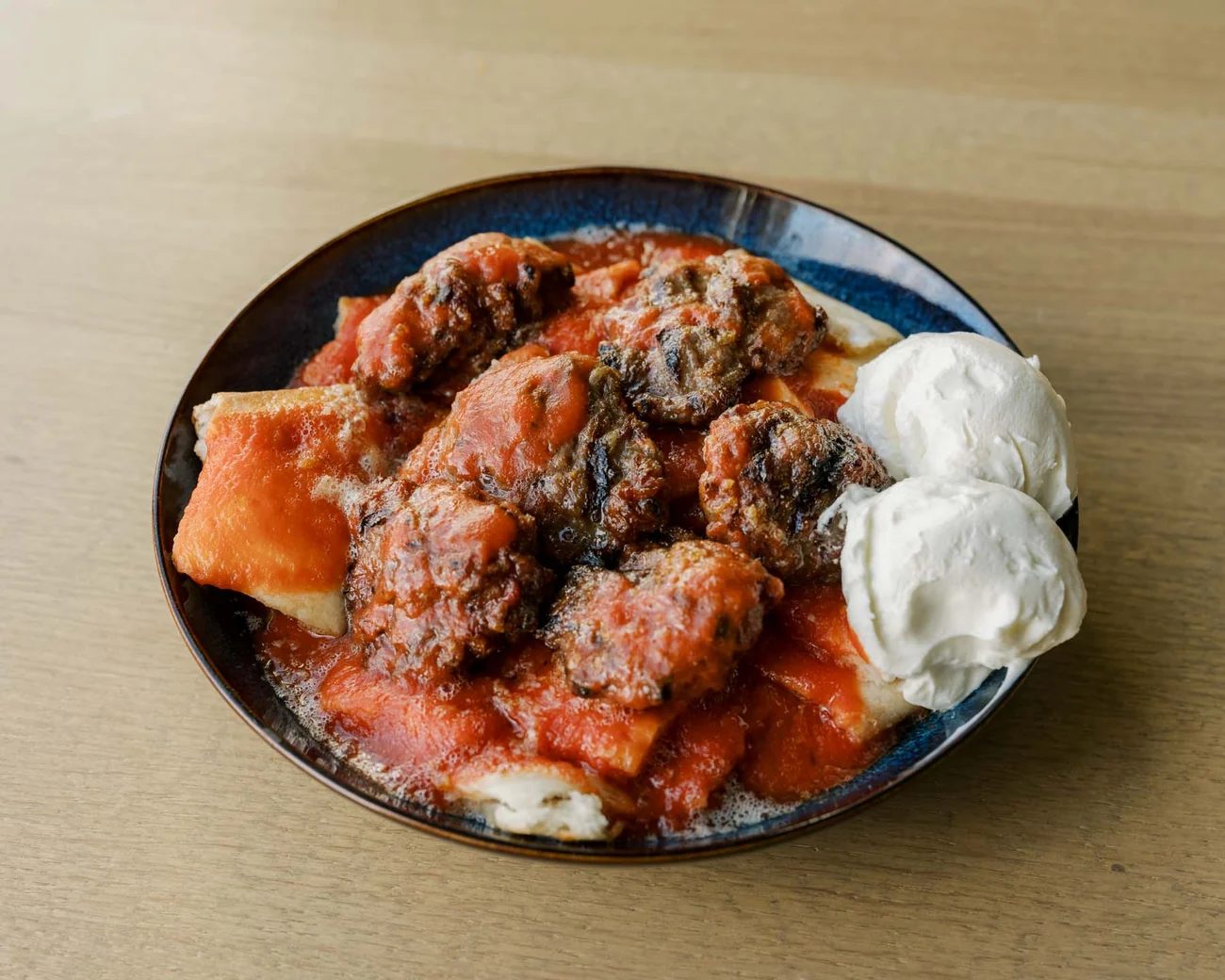 The Hungry Odin pideli köfte with handmade meatballs, tomato sauce, pide bread and yogurt